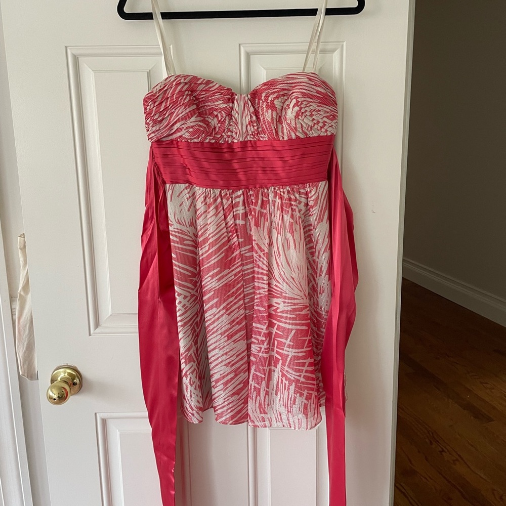 BCBGMaxazria coral, beige and silver strapless cocktail dress with bow in back.